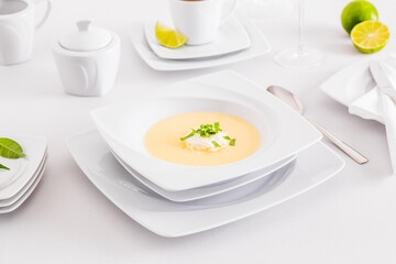 Minimalist white porcelain composition with lemons and avocado