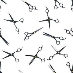 Seamless pattern of black scissors. professional hairdresser black scissors isolated on white....