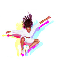 Jumping stylish mixed race young girl on white background. Rainbow colourful studio light. Fiery hip hop dance leap