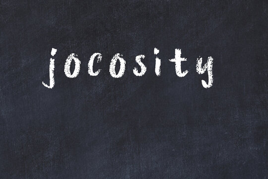 College chalk desk with the word jocosity written on in