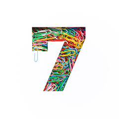 Number seven of colorful paperclips, white cut paper sheet. Seventh numeral. Typeface. Stationery,...
