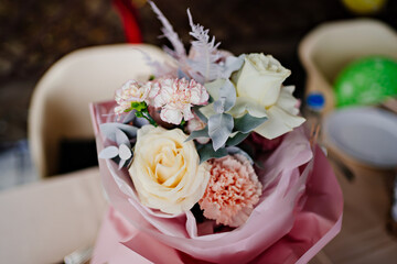 bouquet of the pastel color flowers, yellow, white and pink.roses and carnations