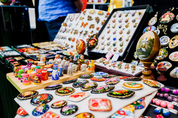 Madrid, Spain - May 20, 2021: Russian crafts sold at a street stand.