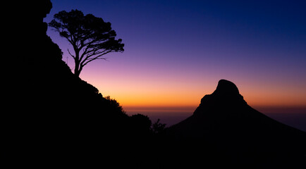 Table Mountain Silhouette sunset after dusk with a beautiful view of Lion's head - Great outdoors adventure and travel holiday destination, Cape Town, South Africa