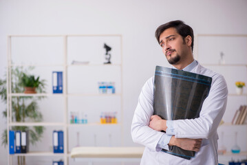 Young male doctor radiologist working in the clinic