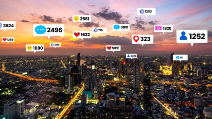 Social media icons fly over city downtown showing people engagement connection through social network application platform . Concept for online community and social media marketing strategy .