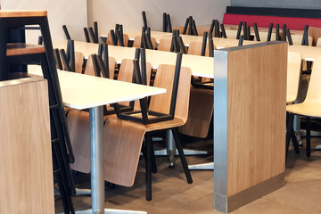stack chairs and tables in area shop, a closed cafe