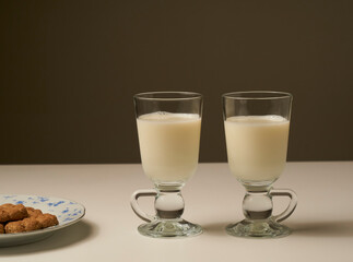 Healthy fresh milk, on white table and dark background.