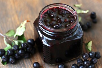 Chokeberry jam, berries in sugar syrup Aronia, Black chokeberry. canning berries for the winter,