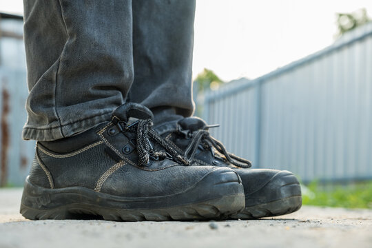 Close Up Workers Wear Safety Shoes To Prevent Accidents At Work.