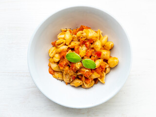 Shell Noodles with Tomato and Ratatouille Sauce in a White Background