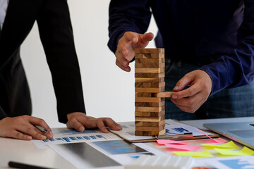 Abstract team business women fail danger tower block game building construction protect plan and project control.strategy and successful intervention concept for business.