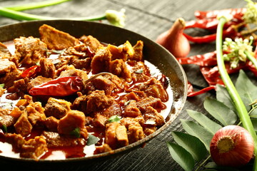 Homemade mutton korma curry cooked in iron skillet- traditional Indian recipes.