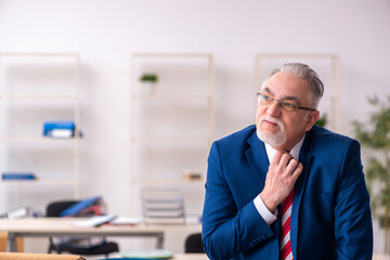Fototapeta premium Old male employee in movement concept