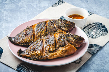 Famous Pinoy Ulam- Fried Tilapia with condiment on the side