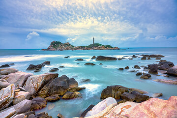 Ke Ga Lighthouse with surf patted smoother reefs create clouds on the sea as this is the only...