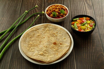 Indian cuisine- wheat chapati, chapthi  served with vegetable curry.