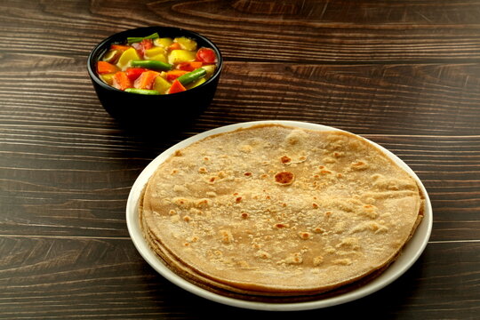 Indian cuisine- wheat chapati, chapthi  served with vegetable curry.