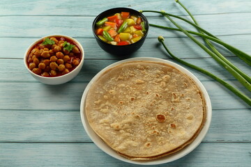 Indian recipes, cuisine- Homemade soft chapati with curry.