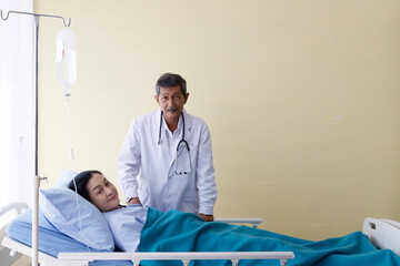 Asian male elderly gray hair and mustache doctor in white lab coat uniform with stethoscope visit...