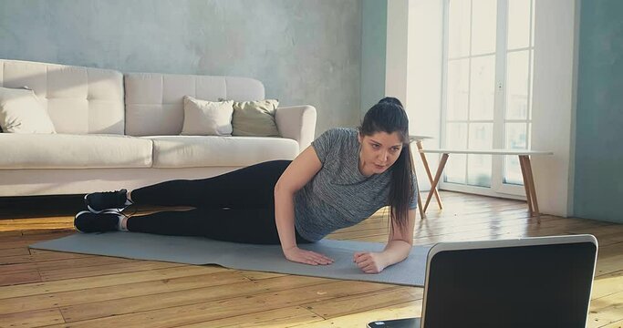 Woman Does Supine Side Leg Raises At Online Training