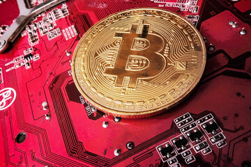 the bitcoin coin is on the graphics card board