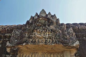Details of the architecture of the ancient temple of Angkor against the background of the sky. The...