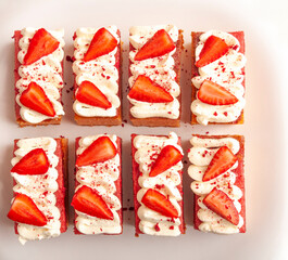strawberry cake with white cream, on white background, image from above