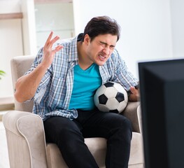 Man watching tv at home