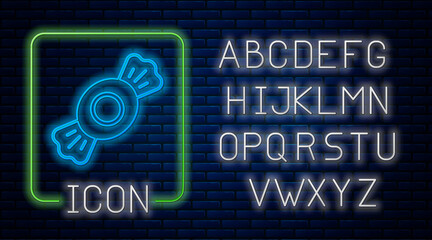 Glowing neon Candy icon isolated on brick wall background. Neon light alphabet. Vector