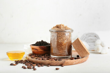 Composition with coffee body scrubs on light background