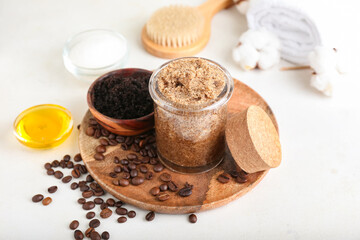 Composition with coffee body scrubs on white background