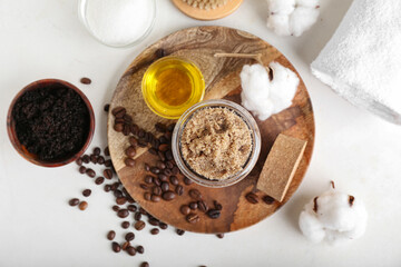 Composition with coffee body scrubs on white background