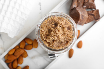 Composition with natural body scrub and ingredients on light background