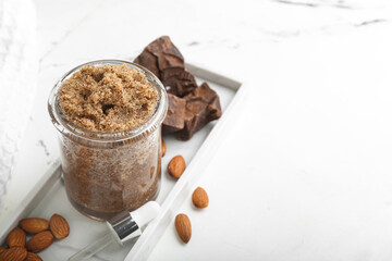 Composition with natural body scrub and ingredients on light background