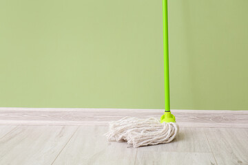 Floor mop near color wall