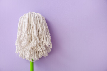 Floor mop on color background, closeup