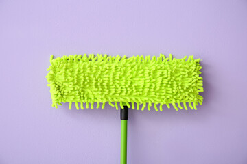 Floor mop on color background, closeup