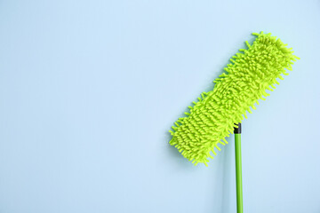 Floor mop on color background