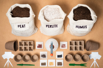 A complete eco-friendly biodegradabale seed starting kit, with peat moss, perlite and worm humus for a potting soil mix, peat trays, pots, an atomizer, plant labels and different seeds.