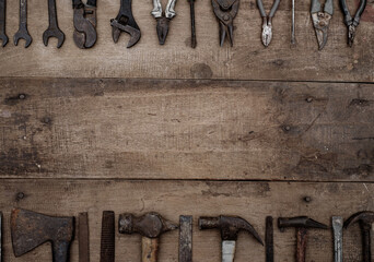 Collection of antique woodworking handtools on a rough workbench old wooden - Powered by Adobe