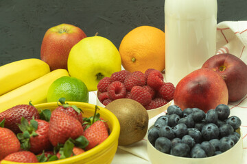 Fresh fruit and milk for making a milkshake