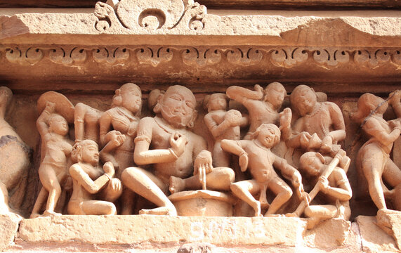 Ffigures of dancing musicians at temple, Khajuraho, India
