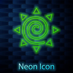 Glowing neon line Sun icon isolated on brick wall background. Summer symbol. Good sunny day. Vector