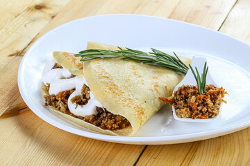 Pancake with minced meat and sauce