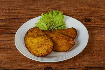 Baked potato with herbs and spices