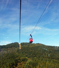 Fototapeta premium Arial Cableway cabin from Stresa to Mottarone mountain. Lake Maggiore, Italy