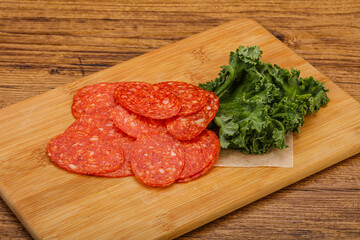 Italian spycy pepperoni sausage slices