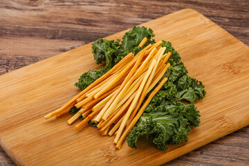 Chechel cheese sticks over board