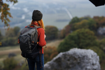 woman hiker backpack travel landscape mountains adventure